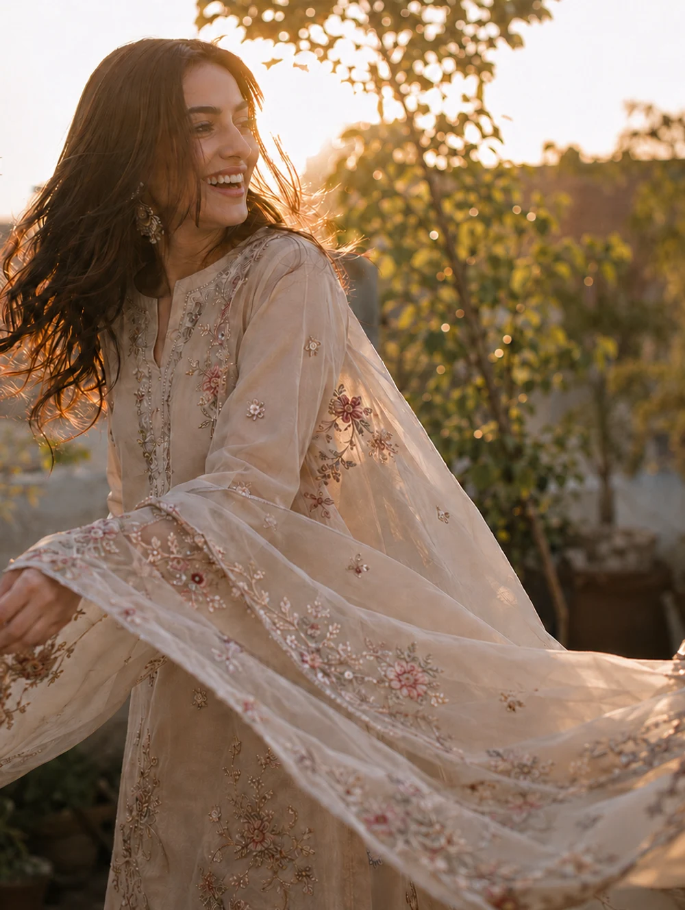A ZARQOSH embroidered summer look moving in golden-hour light